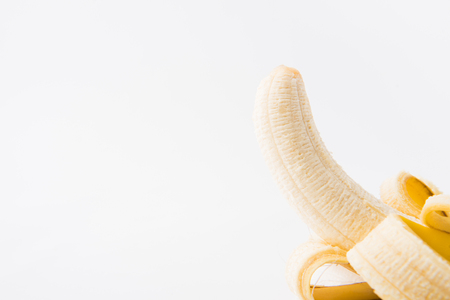 raw peeled banana isolated on white backgroundの写真素材