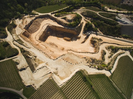 Aerial view of sand quarry with fields around, Germanyの写真素材