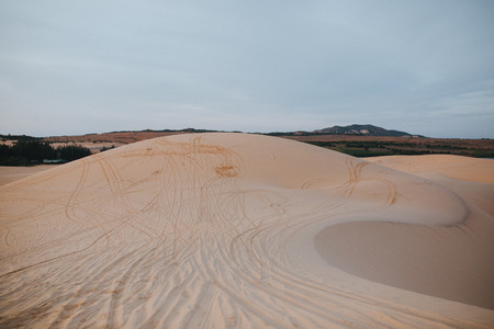 amazing landscape with beautiful sand dunes in desert near Mui Ne, Vietnamの写真素材