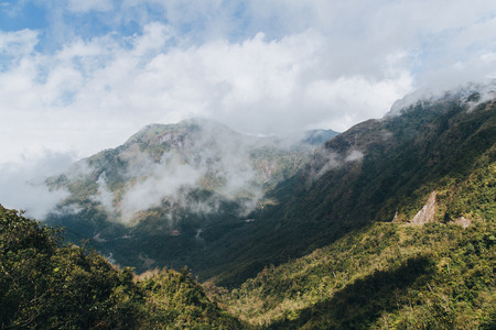 beautiful landscape with green vegetation on mountains and cloudy sky in Sa Pa, Vietnam