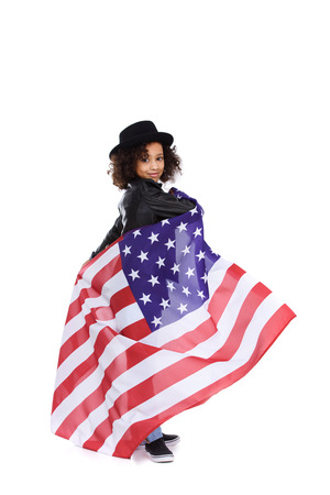 happy little child in stylish hat with usa flag isolated on whiteの写真素材