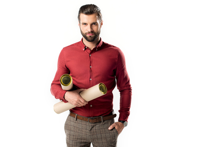 portrait of confident architect with blueprints looking at camera isolated on whiteの写真素材