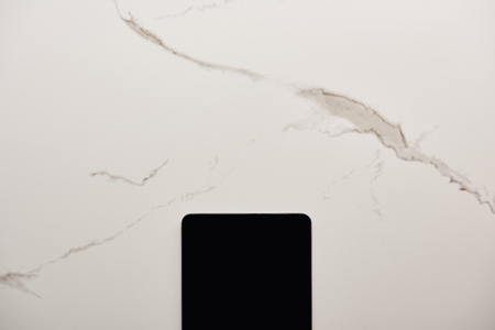 Top view of digital tablet on white marble surface
