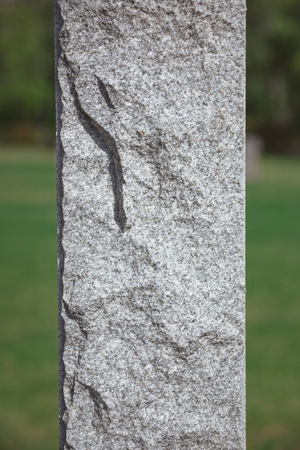 Close up shot of stone memorial monument at cemeteryの写真素材