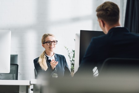 selective focus of young business people talking in office