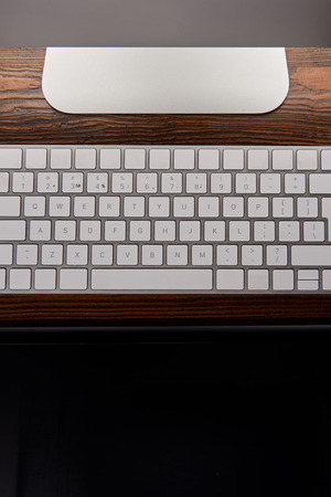 top view of computer keyboard with graphics tablet on wooden tableの写真素材