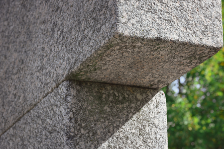 partial view of memorial tombstone in shape of cross at graveyardの写真素材