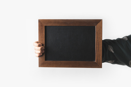 cropped image of man holding empty black board isolated on whiteの写真素材