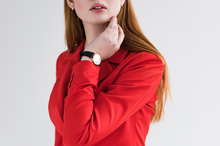 Cropped view of stylish young female with wristwatch isolated on grey
