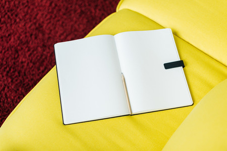 Top view of empty textbook pages with pencil