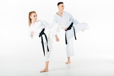 karate fighters training together isolated on whiteの写真素材