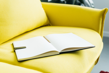 Close up view of empty textbook pages with pencilの写真素材