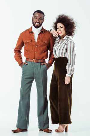 african american retro styled couple looking at camera on whiteの写真素材