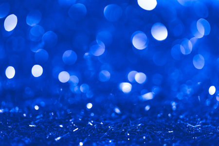 christmas blue blurred shiny confetti with bokehの写真素材
