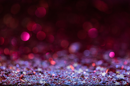 christmas background with pink and silver shiny confetti starsの写真素材