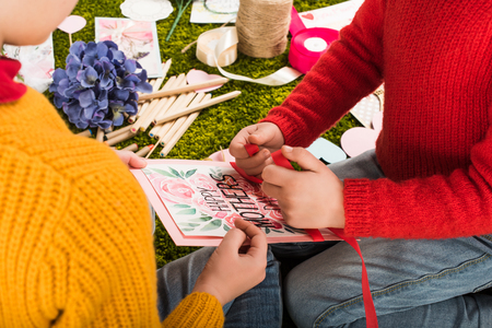 cropped shot of little kids preparing greeting card for mothers dayの写真素材