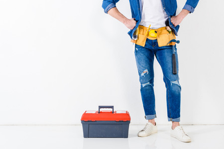 cropped image of worker standing near tools boxの写真素材