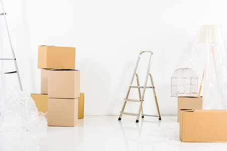 ladders and boxes in new empty apartmentの写真素材