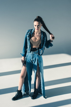 beautiful young woman in trendy denim clothesの写真素材