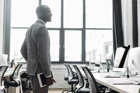 african american businessman with tablet in hand in office