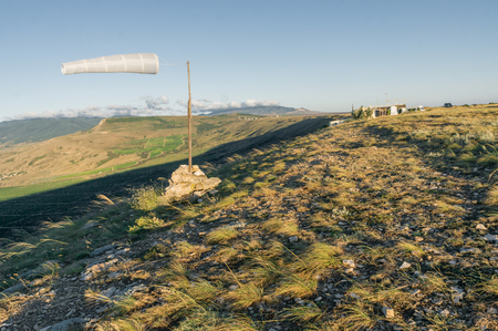 Beautiful mountainous landscape with windsock waving in Crimea, Ukraine, May 2013の写真素材