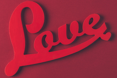 top view of red sign with word love isolated on burgundyの写真素材