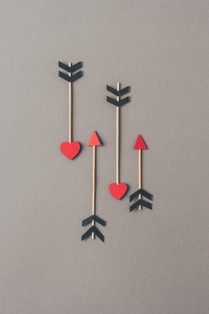 top view of four arrows on gray surfaceの写真素材