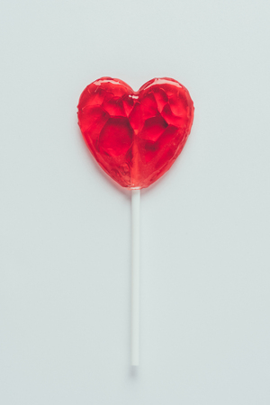 top view of heart shaped lollipop isolated on whiteの写真素材