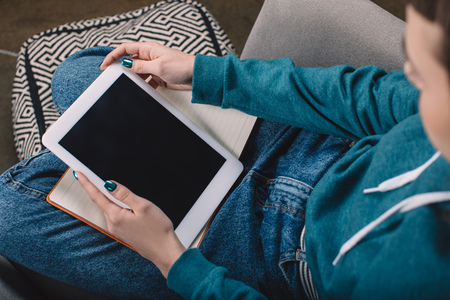 cropped image of girl using tablet