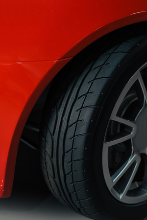 cropped shot of wheel of red sport carの写真素材