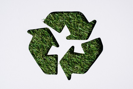 Top view of recycle sign with grass patern isolated on whiteの写真素材