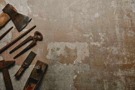 Top view of vintage rusty instruments on old backgroundの写真素材