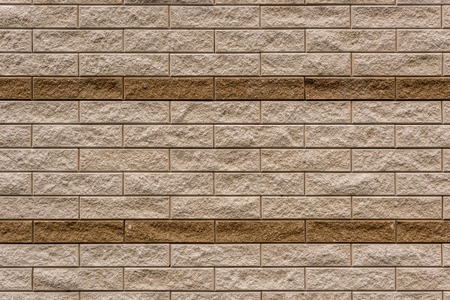 full frame image of beige stone wall background