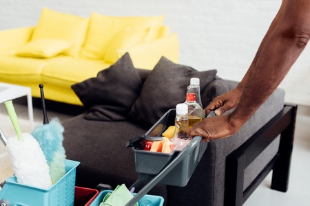 cropped view of male african american hands with housecleaning equipmentの写真素材