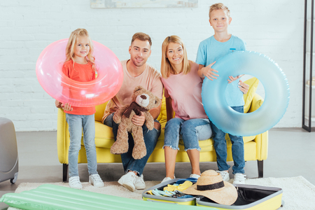 happy family packing baggage for summer vacation, travel conceptの写真素材