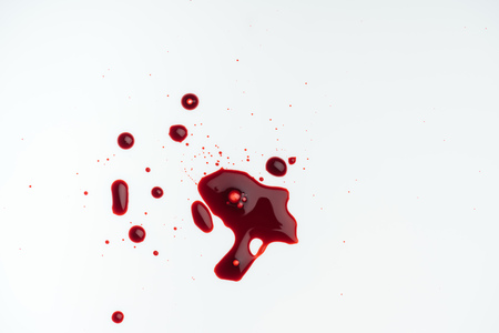 top view of white tabletop with blood blotsの写真素材