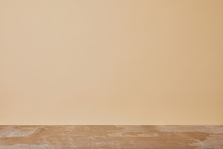 dusty wooden table isolated on beige background