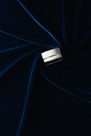 top view of beauty cream on velvet surface