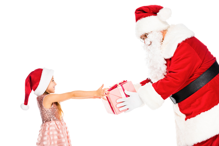 side view of happy santa claus giving present to little child isolated on whiteの写真素材