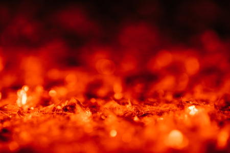 abstract dark christmas background with red blurred glitterの写真素材