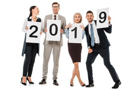 business team holding boards with 2019 new year sign isolated on whiteの写真素材