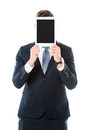 businessman with obscure face holding digital tablet with blank screen isolated on whiteの写真素材