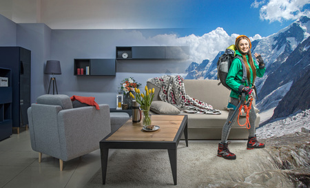 Young climber with climbing equipment dreaming about mountainsの写真素材