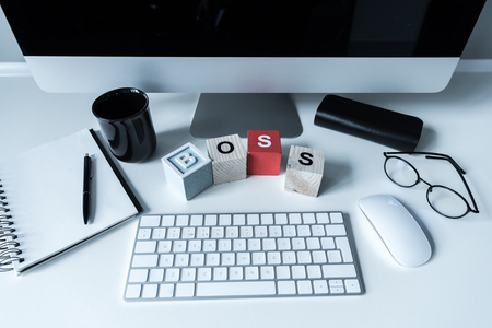 working table with wooden cubes with word Bossの写真素材