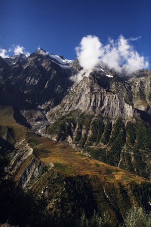 scenic landscape with rocky mountains and clouds in indian himalayas, keylong region