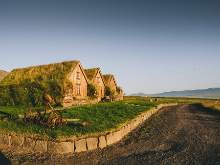 road and traditional icelandic houses with grass roofs, Icelandの写真素材