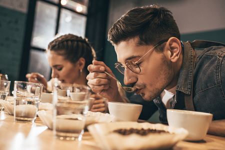 coffee shop workers checking coffee quality during coffee food functionの写真素材