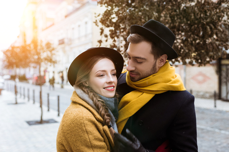 attractive young couple hugging in autumn outfitの写真素材