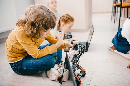 kids sitting on floor at machinery class, stem education conceptの写真素材