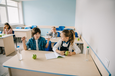 schoolgirl mad at her classmate because of cheating on lessonの写真素材